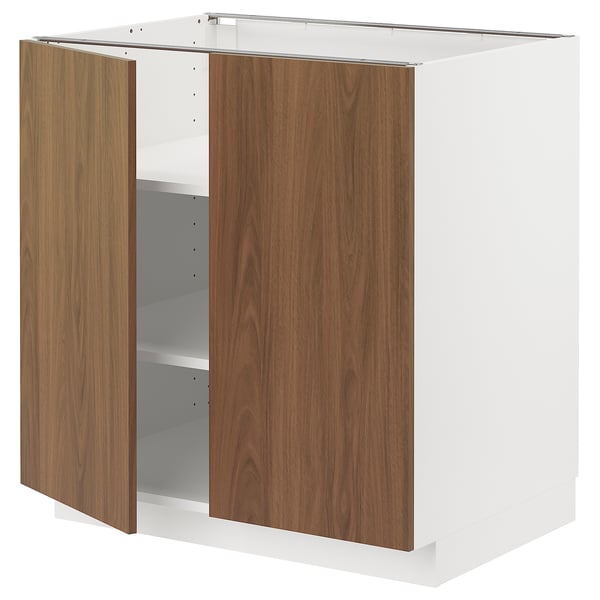 An open METOD kitchen cabinet with tistorp walnut fronts. It two open doors, white sides, and adjustable shelves.