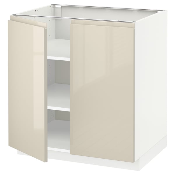 A modern white kitchen cabinet with glossy finish and sleek design from METOD system.