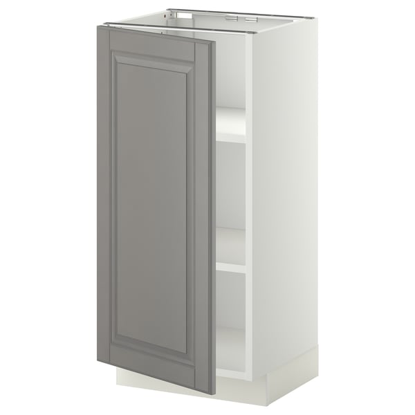 A white METOD kitchen cabinet with a grey door, featuring a traditional design with bevelled edges.