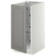 A grey METOD kitchen cabinet with a bevelled door and pull-out wire baskets.