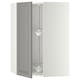 METOD kitchen cabinet in soft grey with open door and glass shelf.