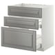 Three grey drawer fronts pulled out, showing modern kitchen cabinet inset in white.