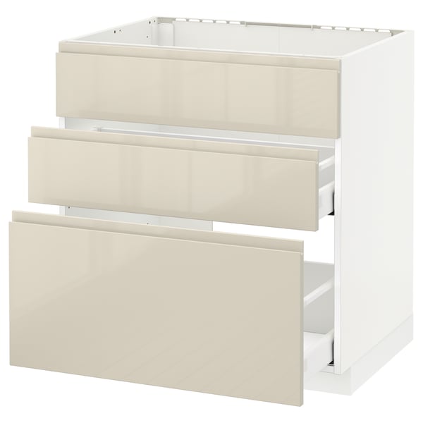 An IKEA METOD kitchen cabinet in beige with three drawers and a high gloss finish.