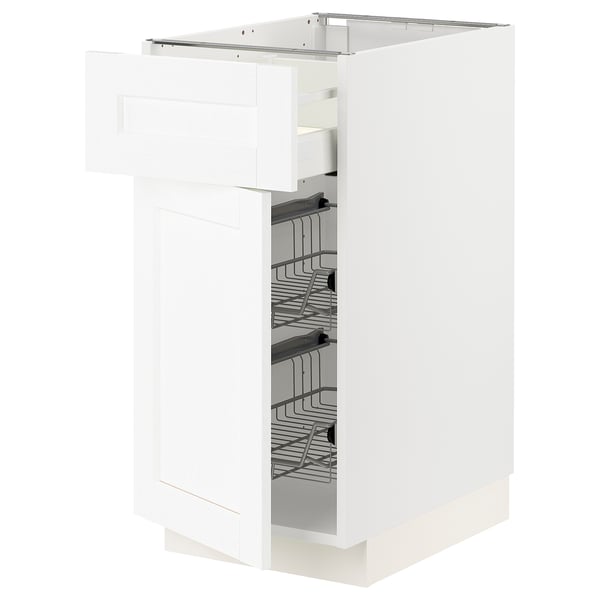 A white METOD kitchen cabinet with silver wire baskets. The cabinet has a modern, sleek design with a partially open drawer for easy access.
