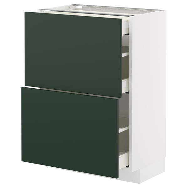 Modern kitchen unit with green drawers, white frame, sleek design.
