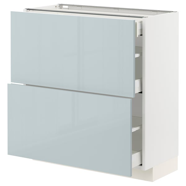 Modern light blue kitchen cabinet with sleek drawers and glossy finish.