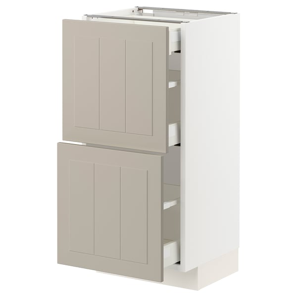Ikea METOD kitchen cabinet, beige, has two drawers and a door, durable construction, modern look.
