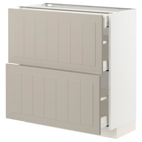 White-beige METOD kitchen unit with beige stensund fronts, featuring wooden panels, rectangular shape, and multiple drawers.