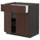Dark brown METOD kitchen unit with sinarp oak veneer fronts, featuring open drawers and shelves.