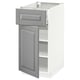Grey cabinet, white interior, one drawer open.