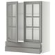 A modern grey METOD kitchen cabinet with glass doors and adjustable shelves.