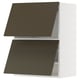 A METOD kitchen cabinet with dark brown/beige havstorp fronts, featuring a sturdy frame and sleek design.