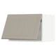 Beige METOD kitchen cabinet with vertical panels and sleek design.