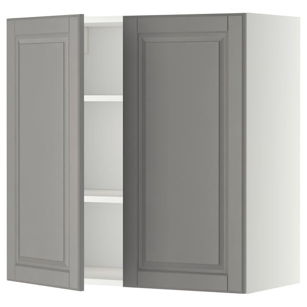 Modern grey kitchen cabinet with one open door, rectangular shape, and bevelled edges.