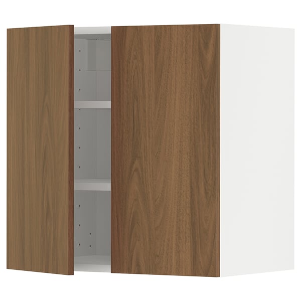 A METOD kitchen system wall cabinet with tistorp walnut-colored doors, featuring adjustable shelves and sturdy construction.