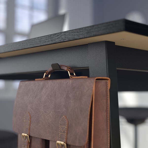 Dark wood shelf with brown leather bag, featuring hooks for organising items.
