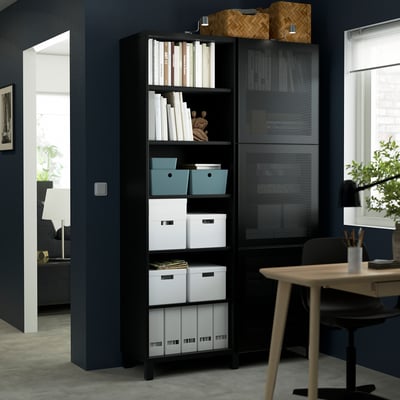 Black MÖRTVIKEN storage unit with mesh doors; holds books & bins, tall, sleek, modern design.