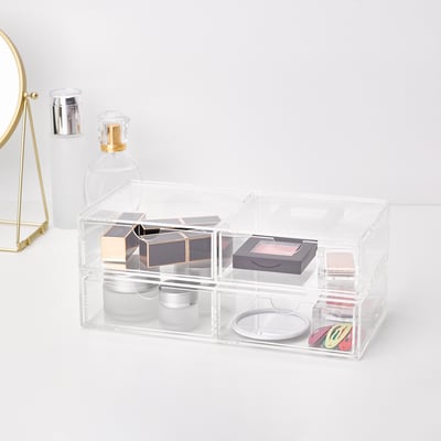 Clear acrylic storage box with 2 drawers, organising makeup and jewellery.