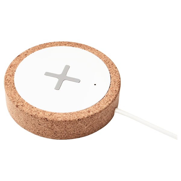 Nordmarke wireless charger in natural cork colour, circular shape with cross design, made from sustainable cork and plastic.