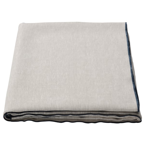Folded light grey linen tablecloth with dark edge, minimalist design.