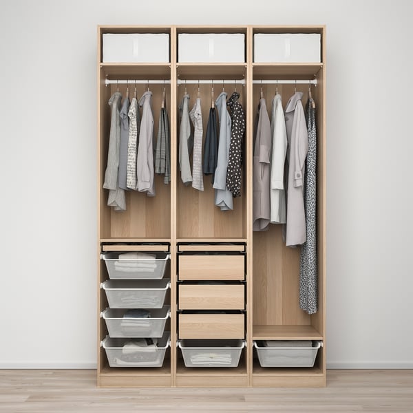 Wooden wardrobe with hanging clothes, shelves, and storage baskets.