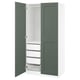 Modern PAX wardrobe with green doors, white interior, shelves, and drawers.
