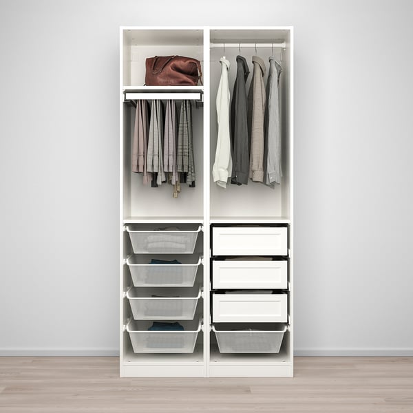 White wardrobe with hanging clothes, folded clothes in drawers, and a handbag on top.