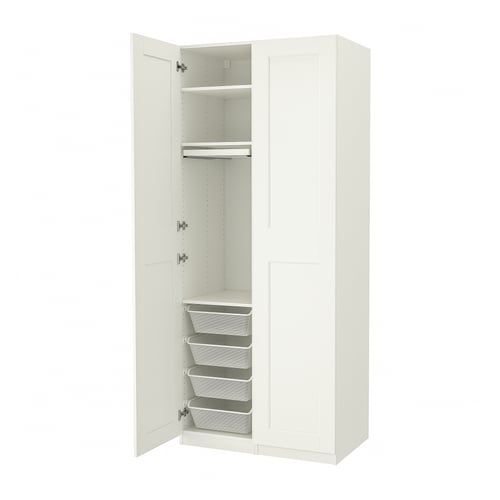 A white PAX wardrobe with open doors, featuring shelves, drawers, and storage baskets.
