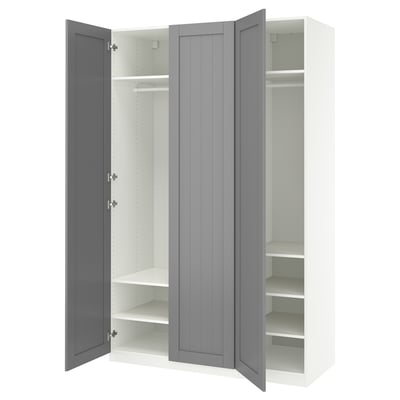 A white and grey PAX wardrobe with three open sections: two with shelves and one with a hanging rod.