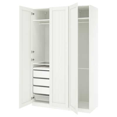 A white ikea PAX wardrobe with open doors revealing shelves and drawers.