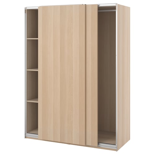 Light pine ikea PAX wardrobe with sliding doors and shelves.