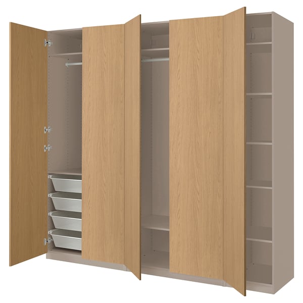 Depicts a light brown PAX wardrobe with open doors. It shelves and drawers for storage.