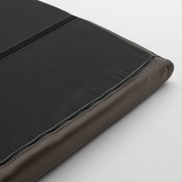 Black leather-bound book or folder with neat stitching and smooth edges, showing high-quality craftsmanship.