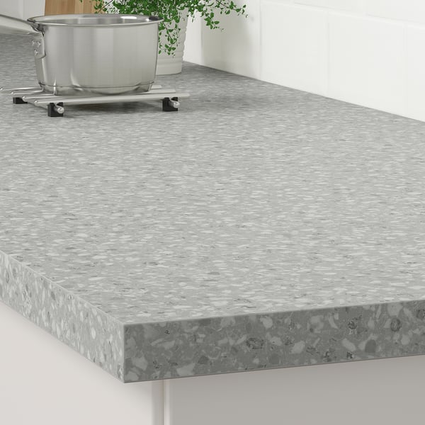 Modern kitchen countertop with laminate surface.