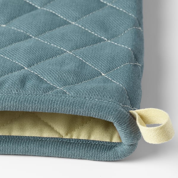 Blue quilted oven mitt with white stitching and a beige loop, showcasing quality craftsmanship.