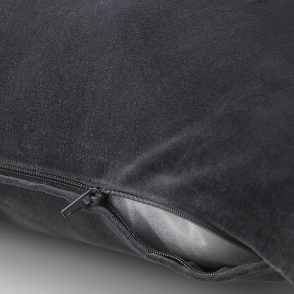Black velvet cushion cover with zip, showing inside lining.