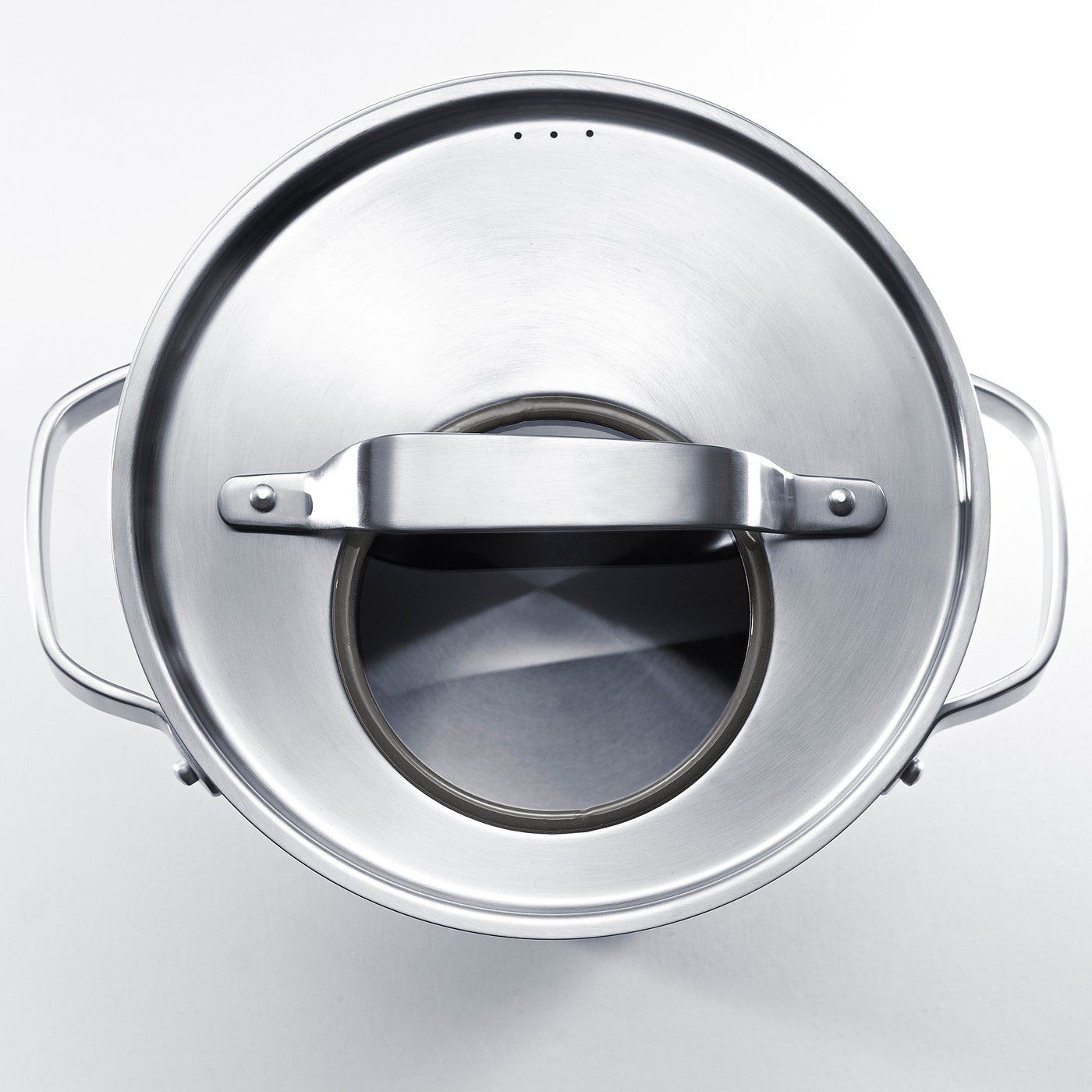 Stainless steel stockpot with glass lid, sturdy handles, & thick base for even heat distribution.