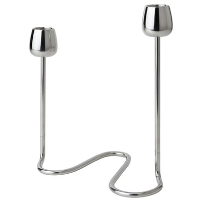 The SILVERPÄRON set includes two stainless steel candlesticks with curved, stem-like bases and rounded cups, reflecting natural flower designs.