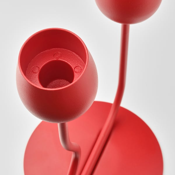 Bright red modern candlestick with elegant curves, featuring multiple candle holders.