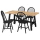 Black wooden dining set with light top & curved chairs - perfect for modern kitchens.