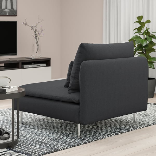 Modern living room with dark grey SÖDERHAMN chair; deep seat, loose cushions, stylish high legs.
