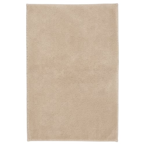 SÖDERSJÖN: beige bath mat. Soft cotton top, latex back. Rectangle shape. Simple design.