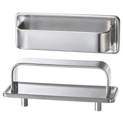Two stainless steel kitchen accessories: a long rectangular handle and a small tray with two legs, designed for a modern yet retro look.