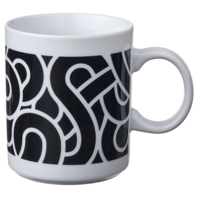 Black and white mug with abstract geometric design. Circular handle, white rim and inside, made of feldspar porcelain.