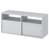 A white SPIKSMED tv bench. It both open and closed storage with sliding doors for a sleek design.