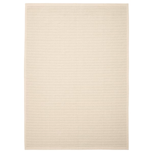 A beige STARREKLINTE rug with light green stripes, made of cotton.