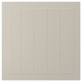 A beige STENSUND cabinet door with grooved panel design.