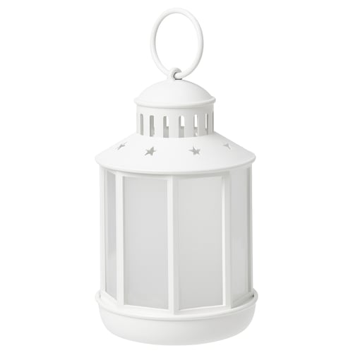 White STRÅLA lantern, cylindrical with star cutouts, hanging loop top.