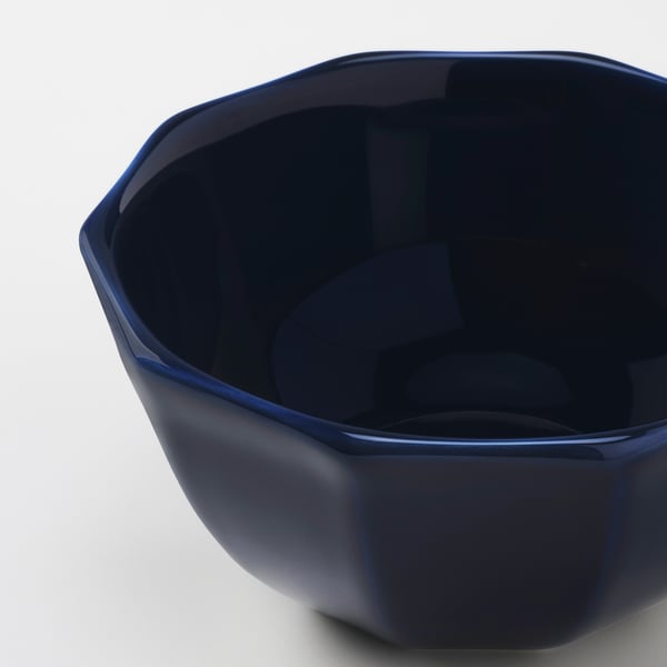 Blue glazed bowl with faceted edges.