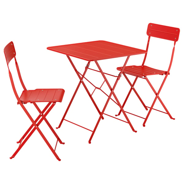 Bright red foldable outdoor table and two chairs set, ideal for small spaces.